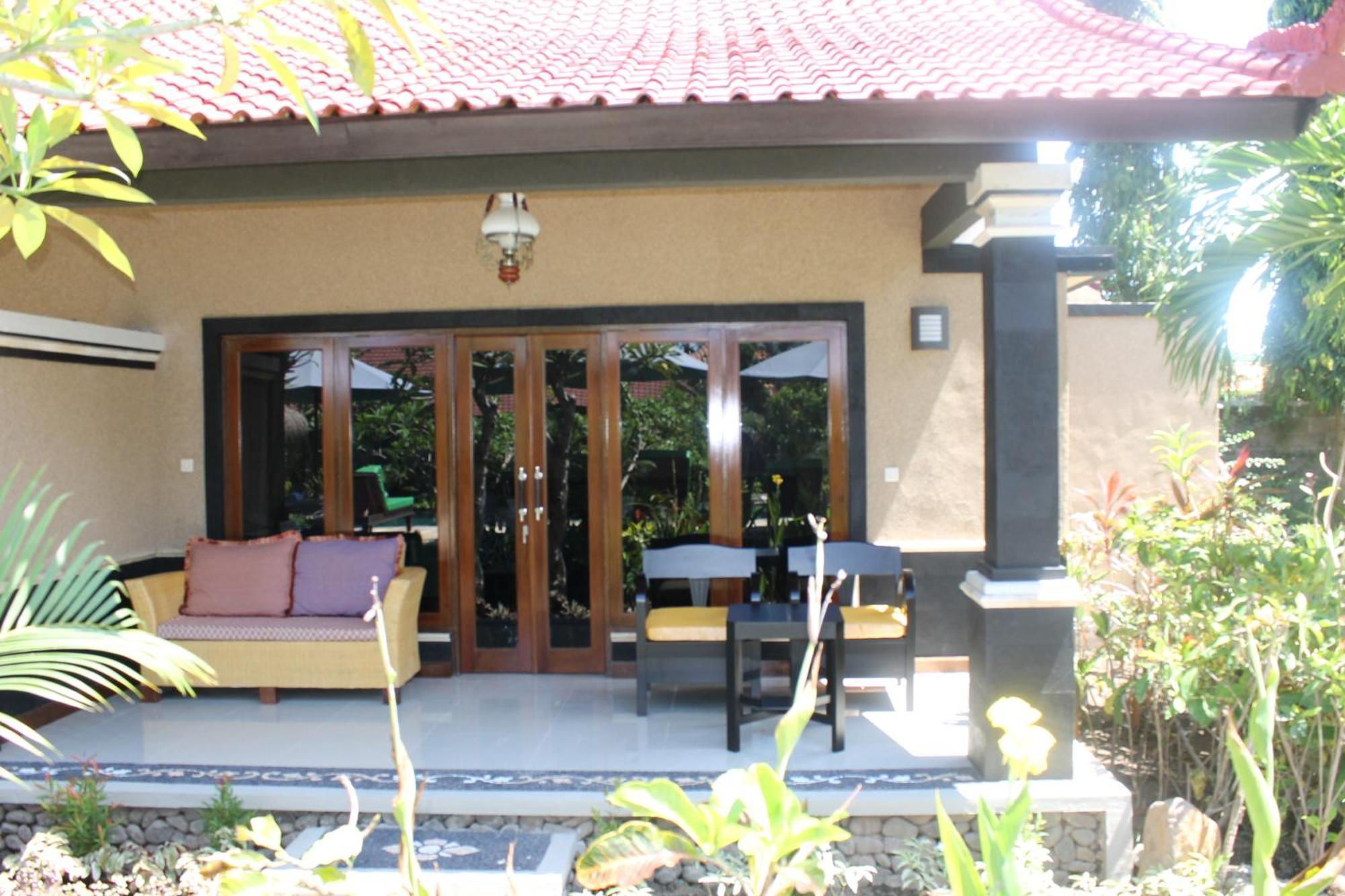 Mans Cottages & Spa Pemuteran Værelse billede